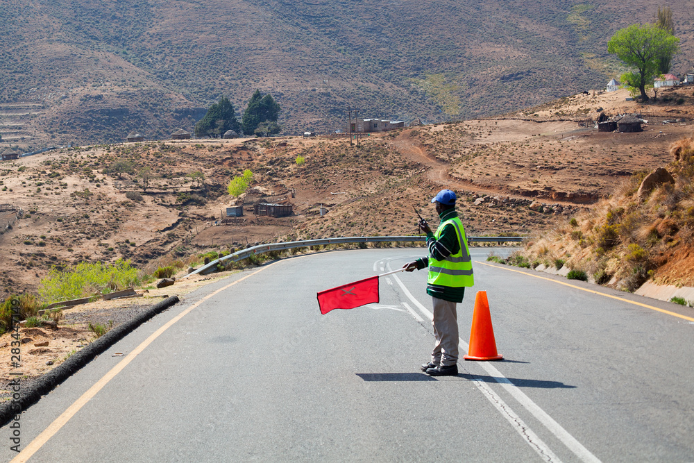 DOT flagger uses radio to communicate